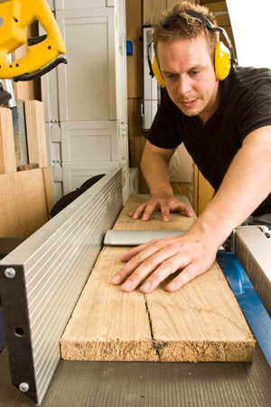Ben Plewes using a planer