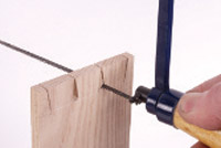 Cutting out waste with a coping saw
