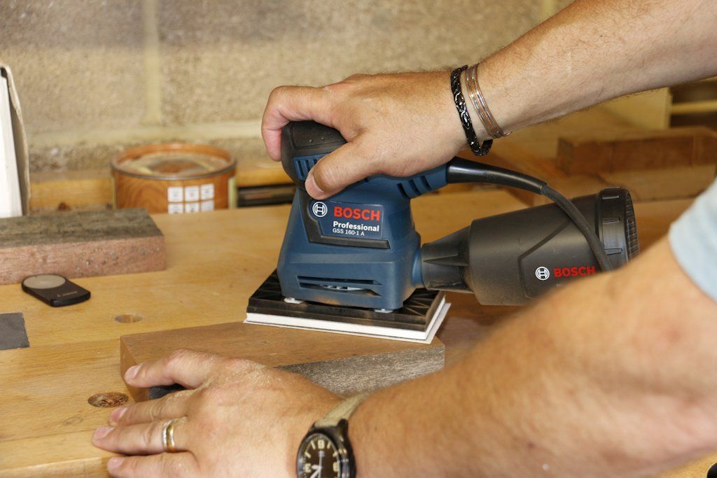 Andy King putting the Bosch GSS 160-1 A Multi Sander through its paces