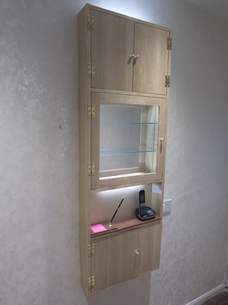 Michael Forster’s slimline hall cabinet cleverly disguises untidy cables and odds and ends
