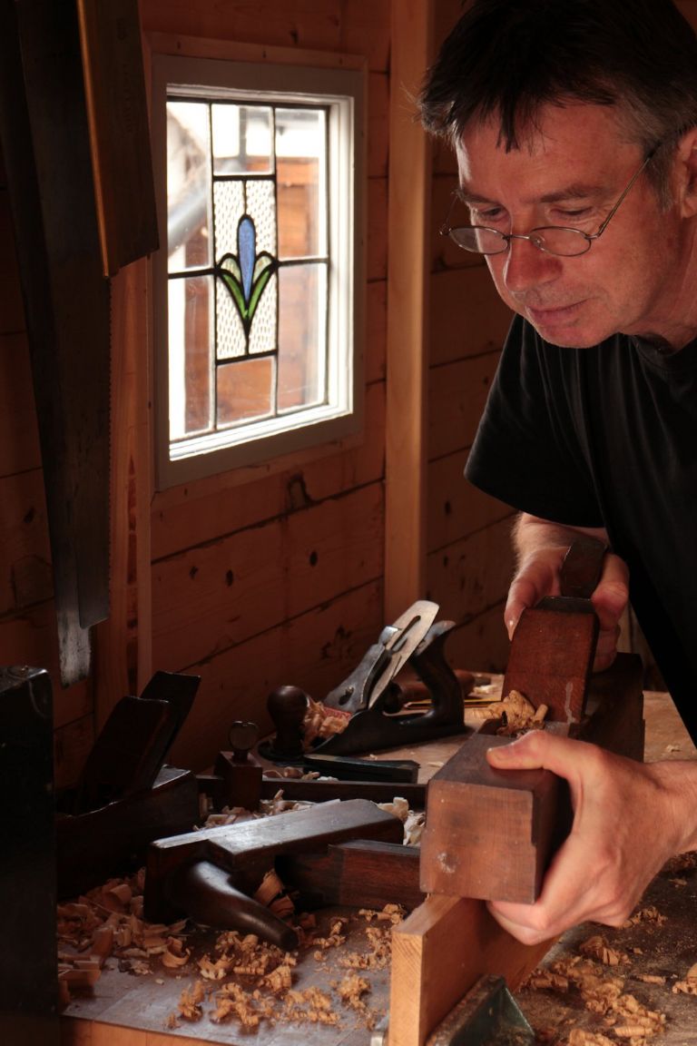 Robin trying out his bench under a new leadlight window