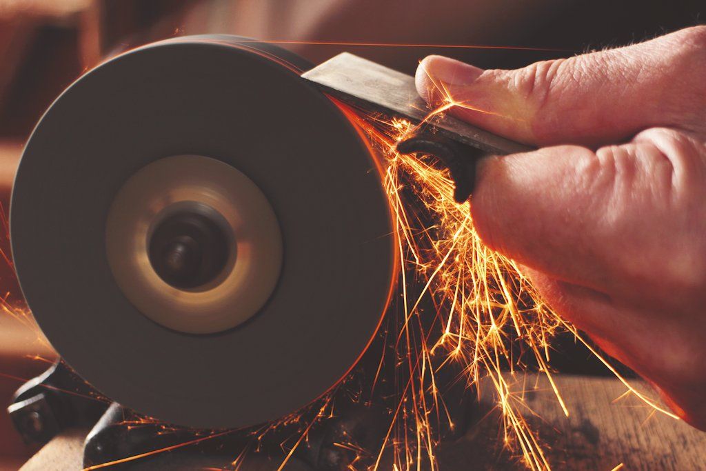 Robin Gates gets busy at the grinding wheel