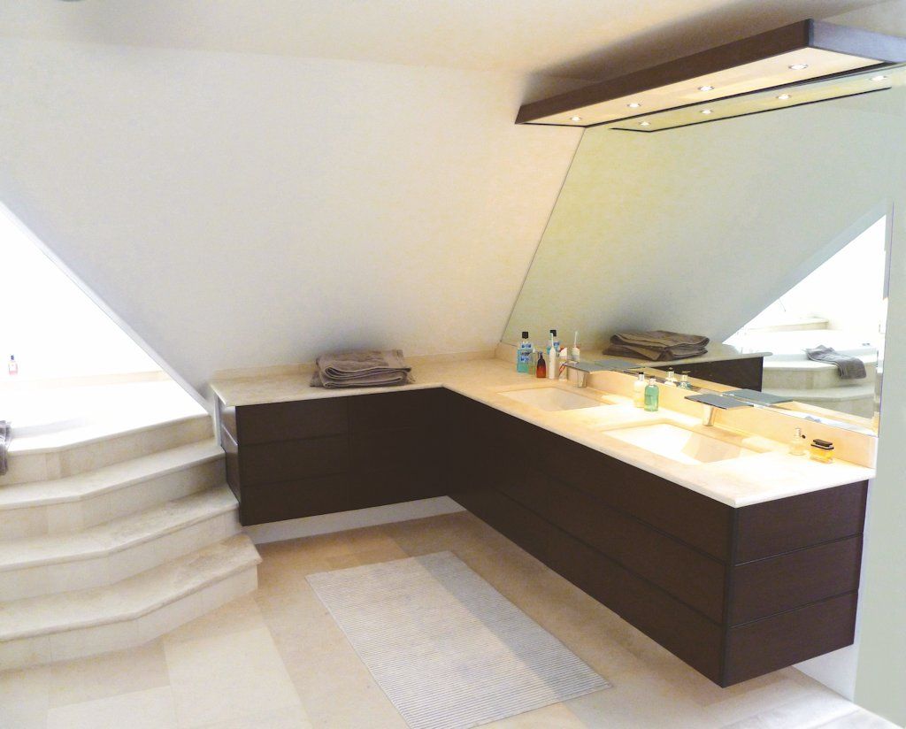 Mark Griffiths thought this was going to be a simple project – that is, until the clients asked for the units to be free floating with stone tops and large porcelain sinks!