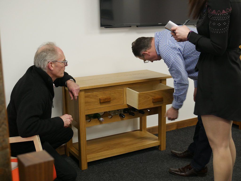 Examining one of Tony Wood’s wine table drawers