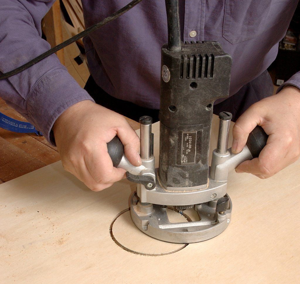 Circles smaller than the router base can be routed without a trammel arm by pivoting through a hole in the router sole
