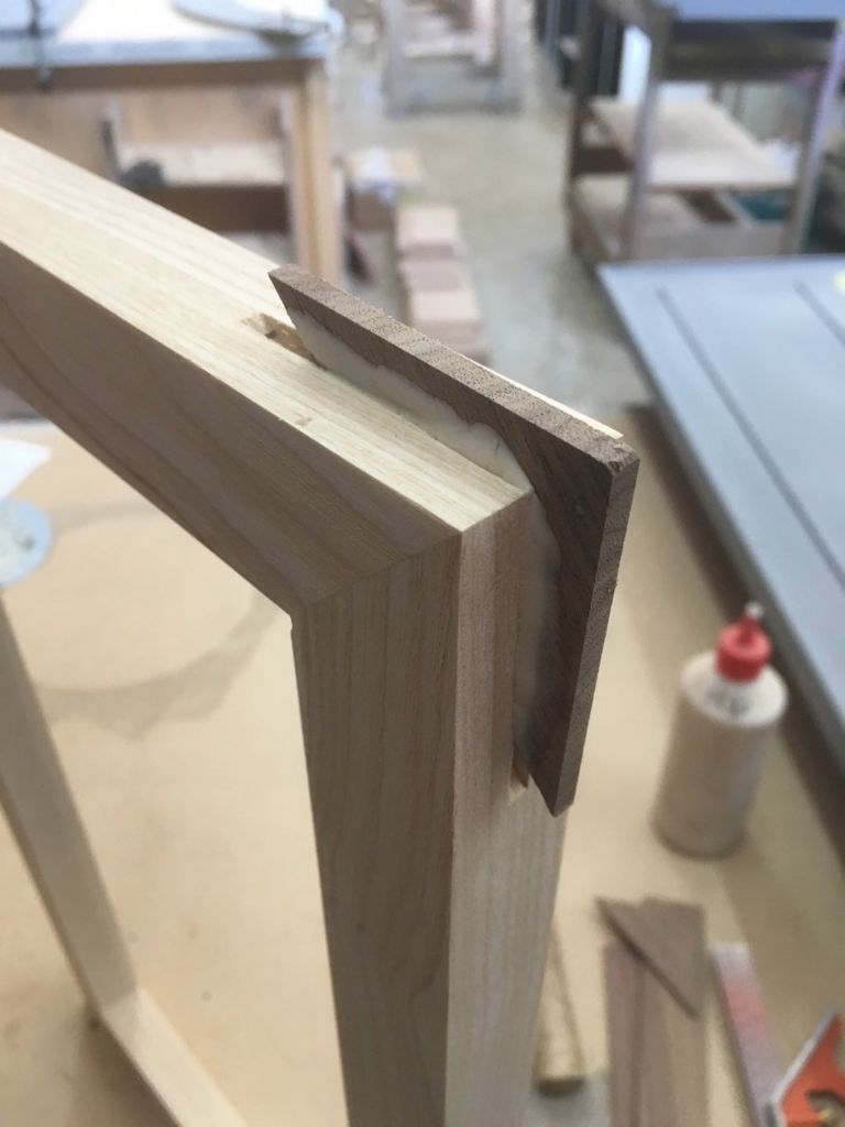 Inserting one of the walnut mitres
