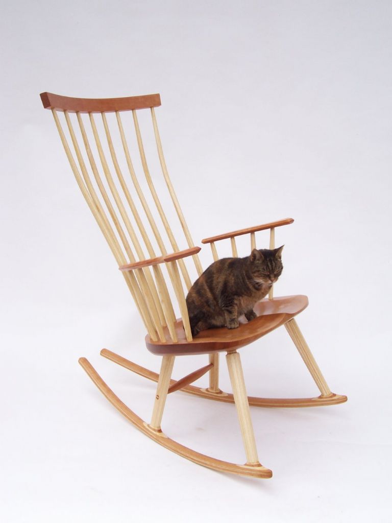 Rocking chair with the ‘Inspector’ in cherry with ash spindles/legs – short rockers for apartment living – overall 813mm wide × 914mm dia. × 1,118mm high - by Michael Brown