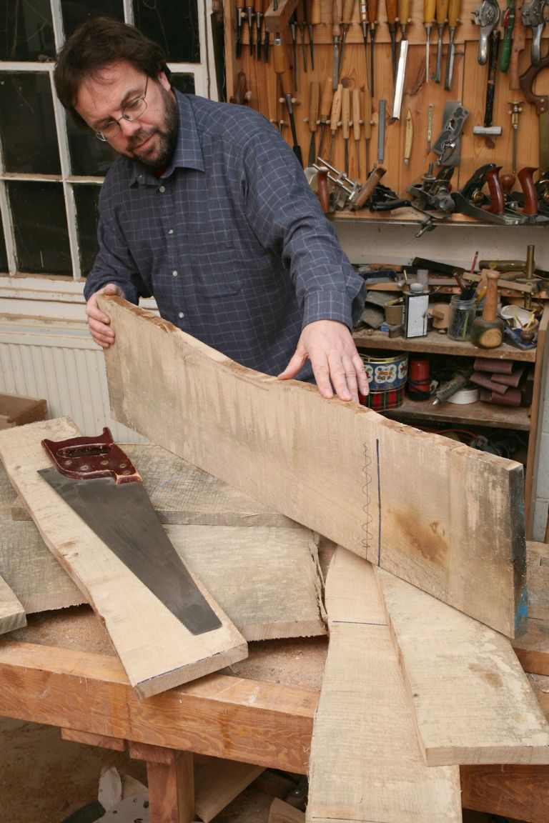 John Bullar shows how a waney edge on each board, which follows the undulations of the outside of the tree, can be ripped off with a handsaw or on the bandsaw or saw table