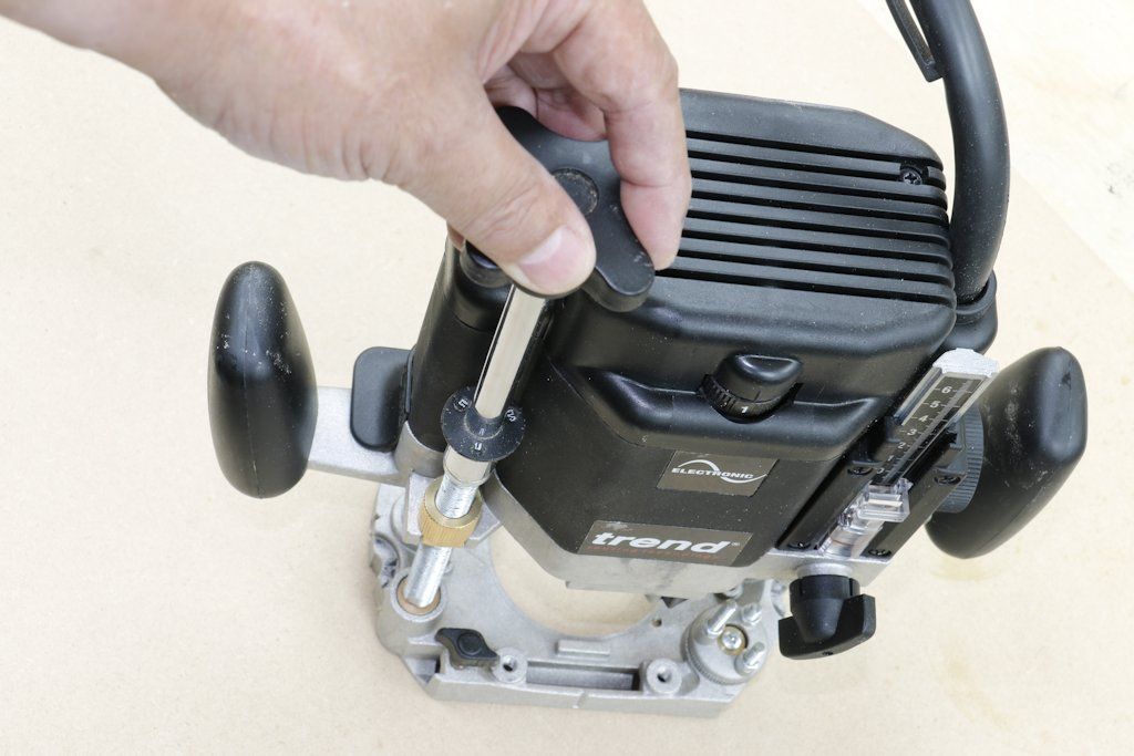 The supplied fine height adjuster on the Trend T11 router can be used for hand-held adjustment from above