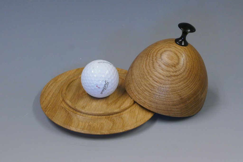 Les Thorne’s cloche box presents and hides a lucky golfer’s hole in one ball