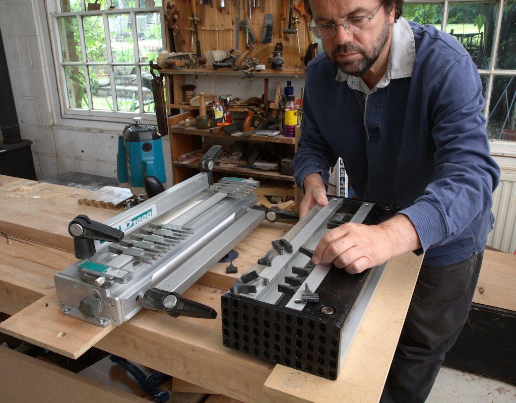 John Bullar setting up a couple of dovetailing jigs: one with infinitely adjustable spacing (left) and one with fixed spacing (right)