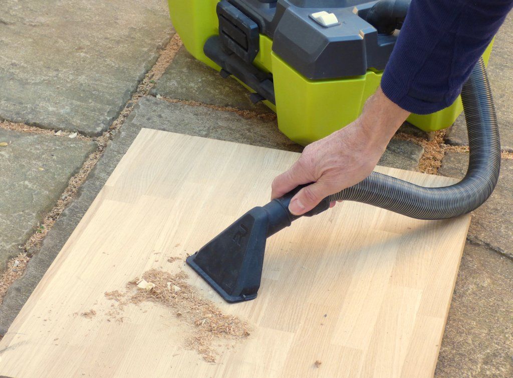 A floor nozzle is provided for vacuuming, which can be stored on the end of the Ryobi ONE+ Project Vac