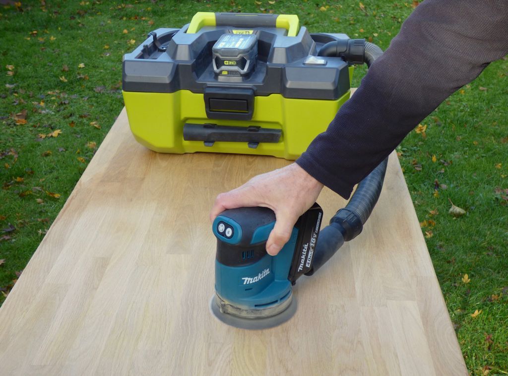 Using the Makita DBO180Z 18V Li-ion LXT cordless random orbital sander on oak kitchen worktops